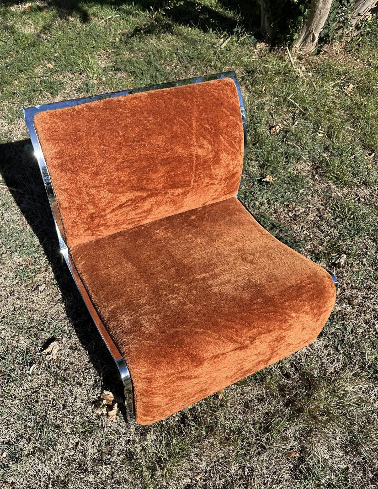 Chrome steel armchair and orange fabric by Vittorio Introini