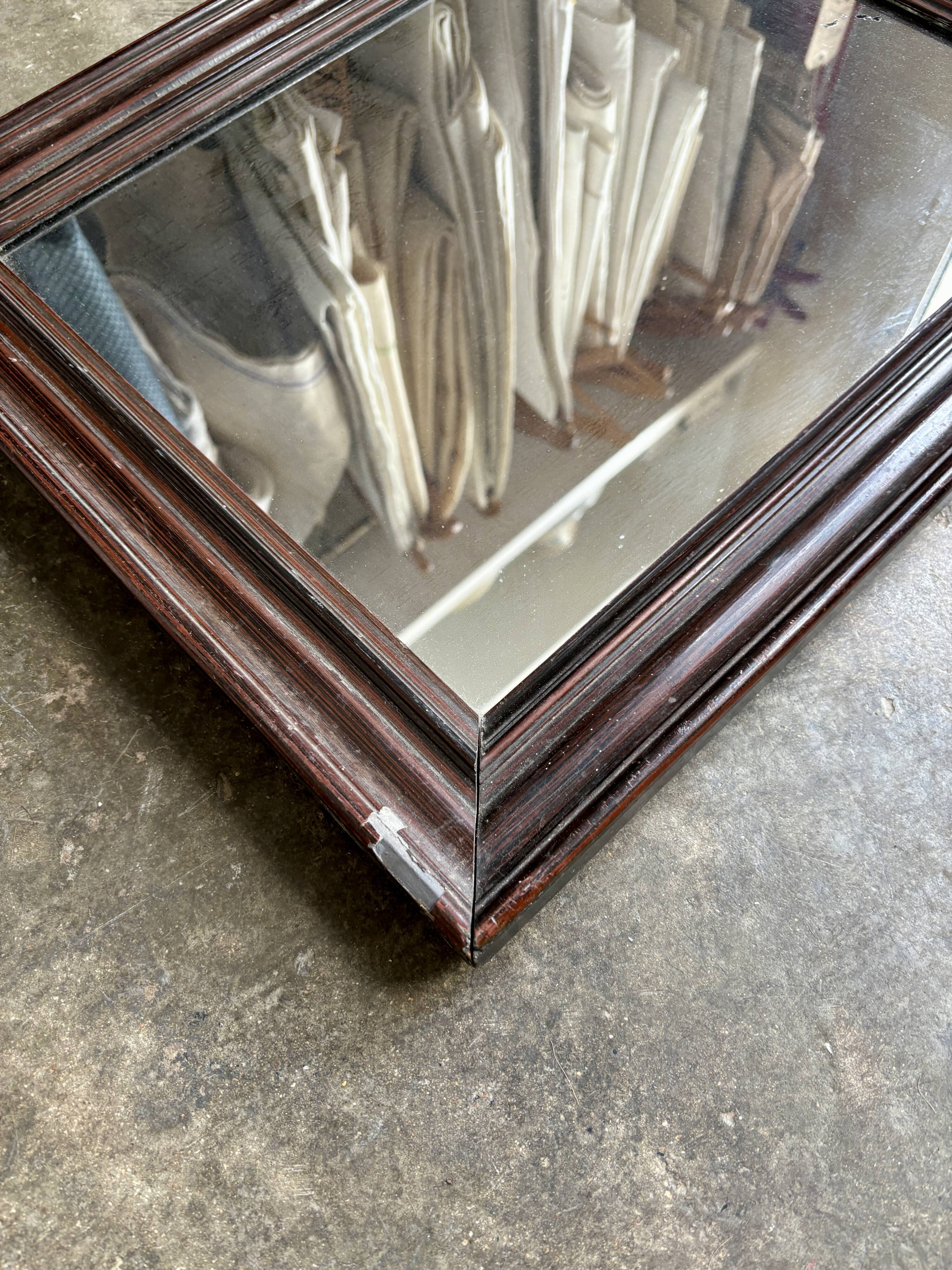 Dark wooden mirror ☐ 49.5 x 40 cm