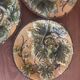 Four antique dessert plates in majolica with vine decoration.