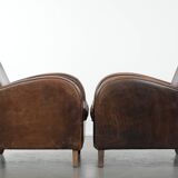 Set of two vintage sheepskin leather design armchairs in a cognac colour