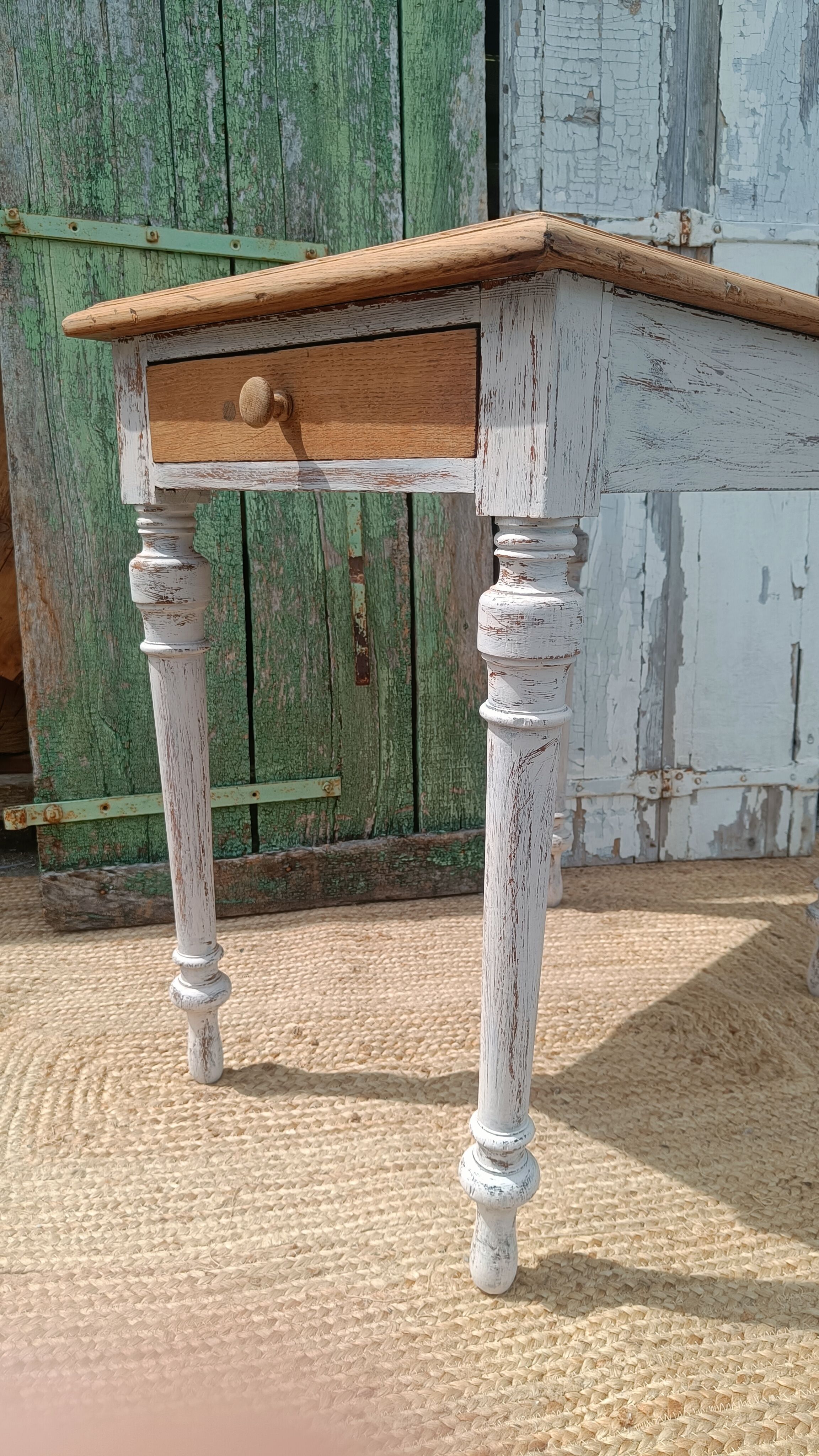 Antique drawer table with a patina.