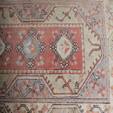 Rug melas Anatolian wool fringe on pink background 208x120cm