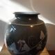 Vase noir a decor vegetal signé Philippe Jacques