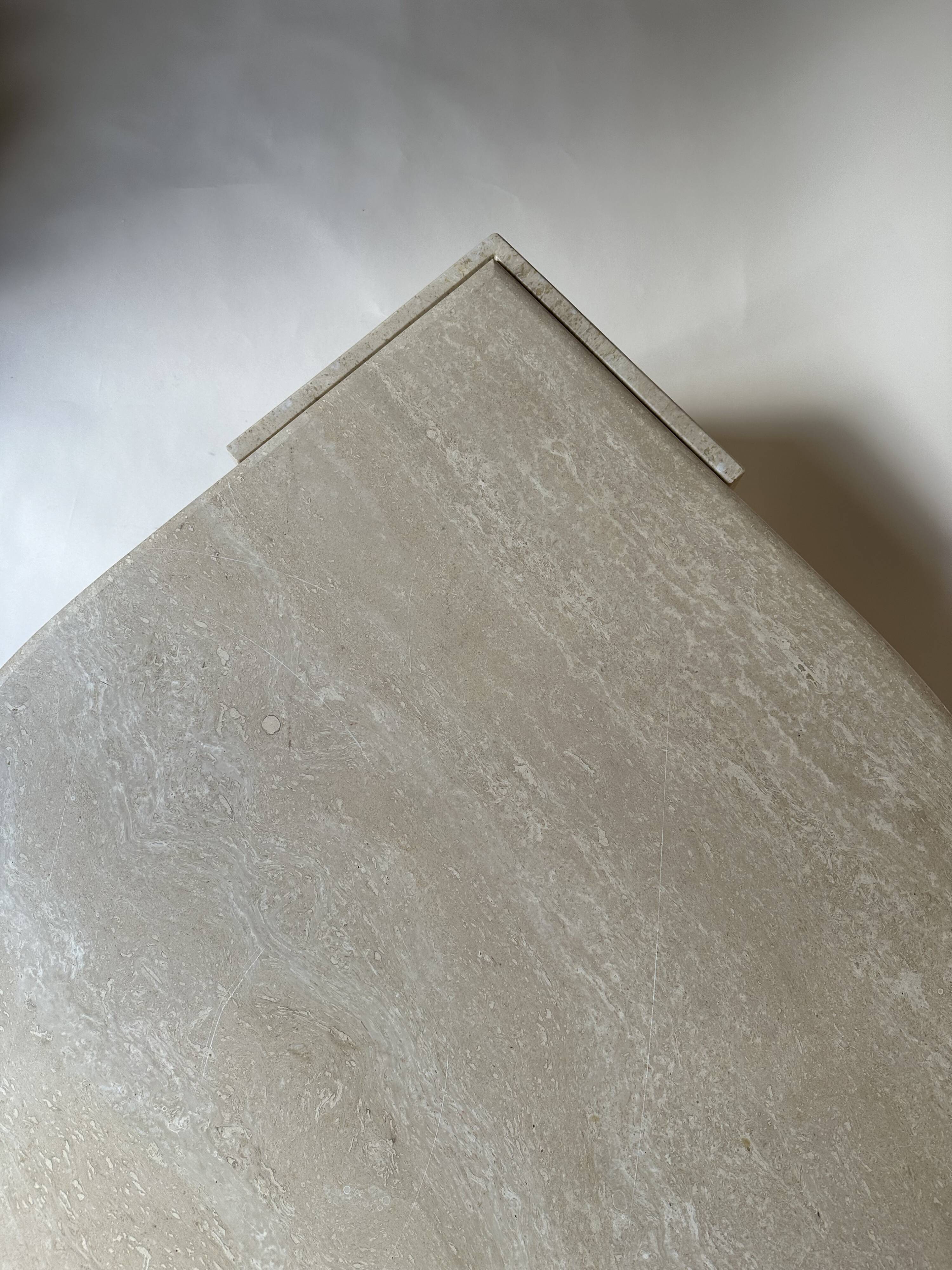 Travertine eye-shaped coffee table