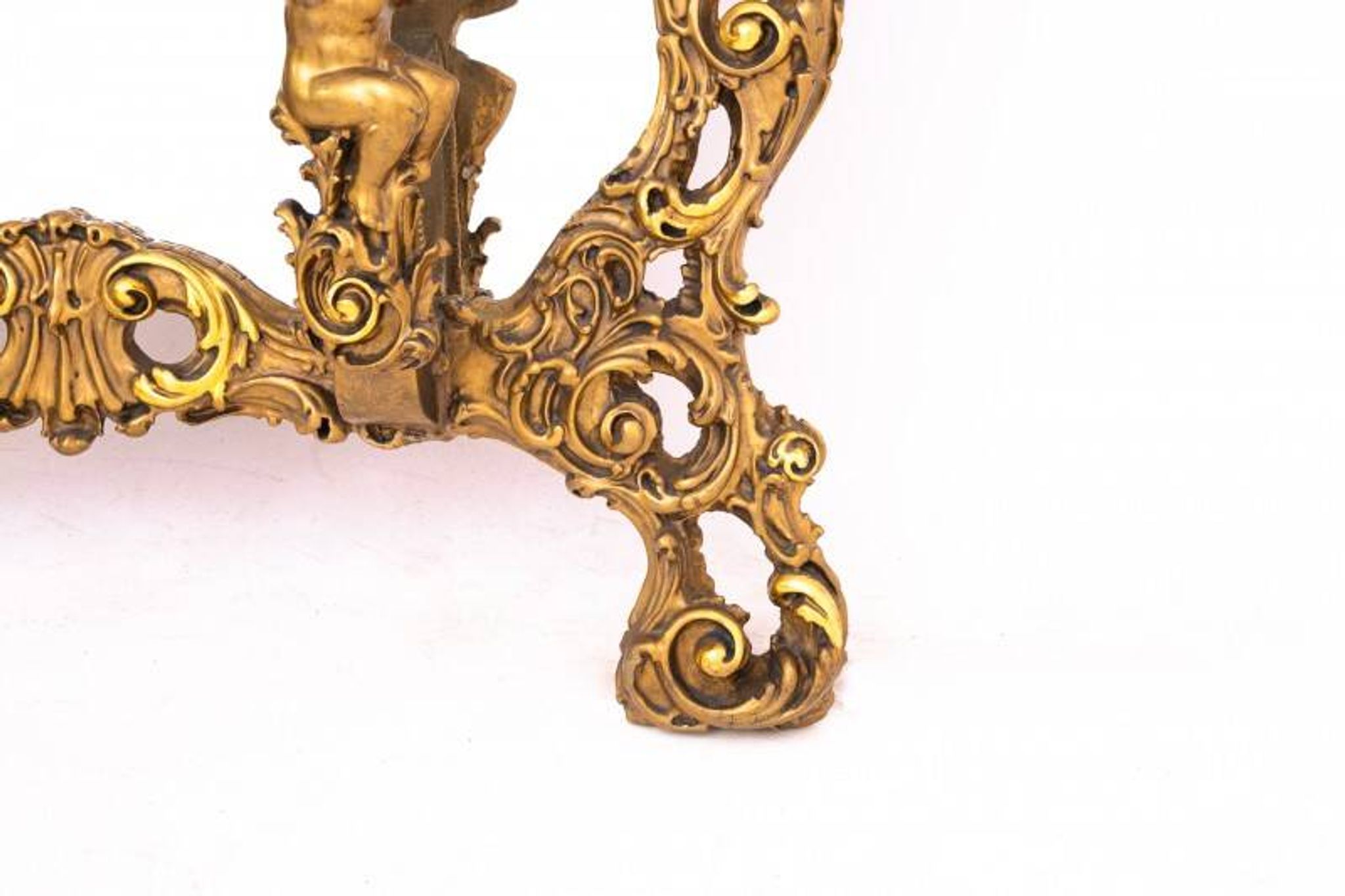 A large mirror in a gold frame, Italy, first half of the 20th century.