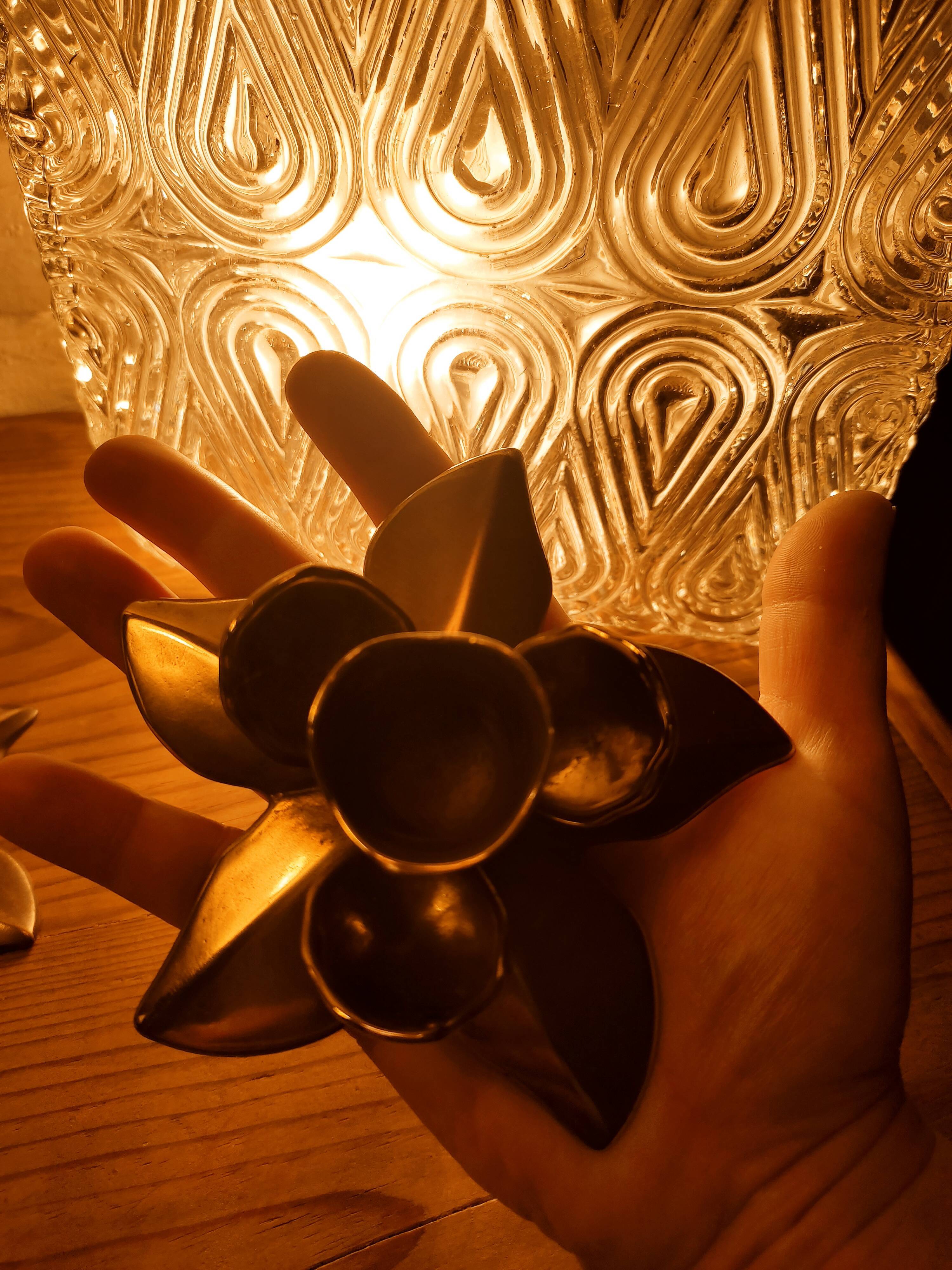Duo of brass star candle holders
