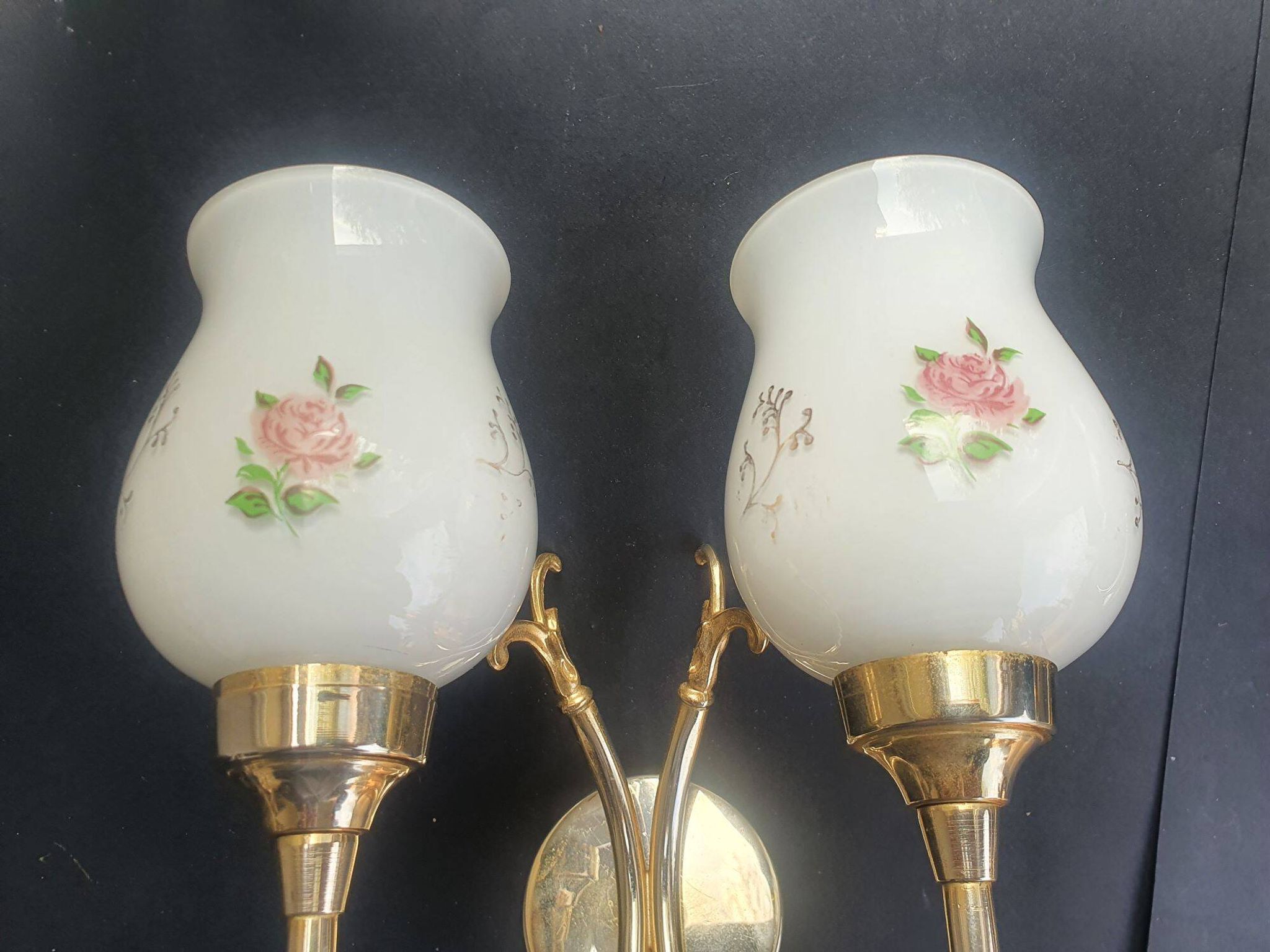 Pair of vintage wall sconces in gilded brass and pink opaline glass.