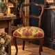 Carved walnut Napoleon III style velvet medallion chair