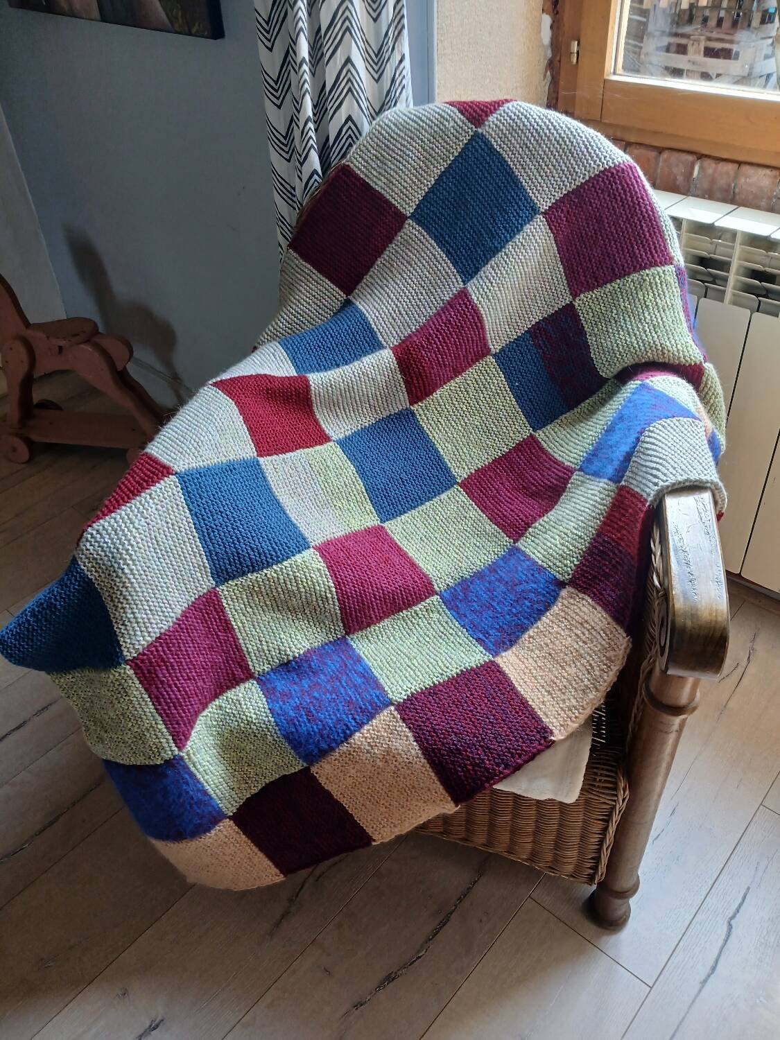 Hand knitted patchwork plaid