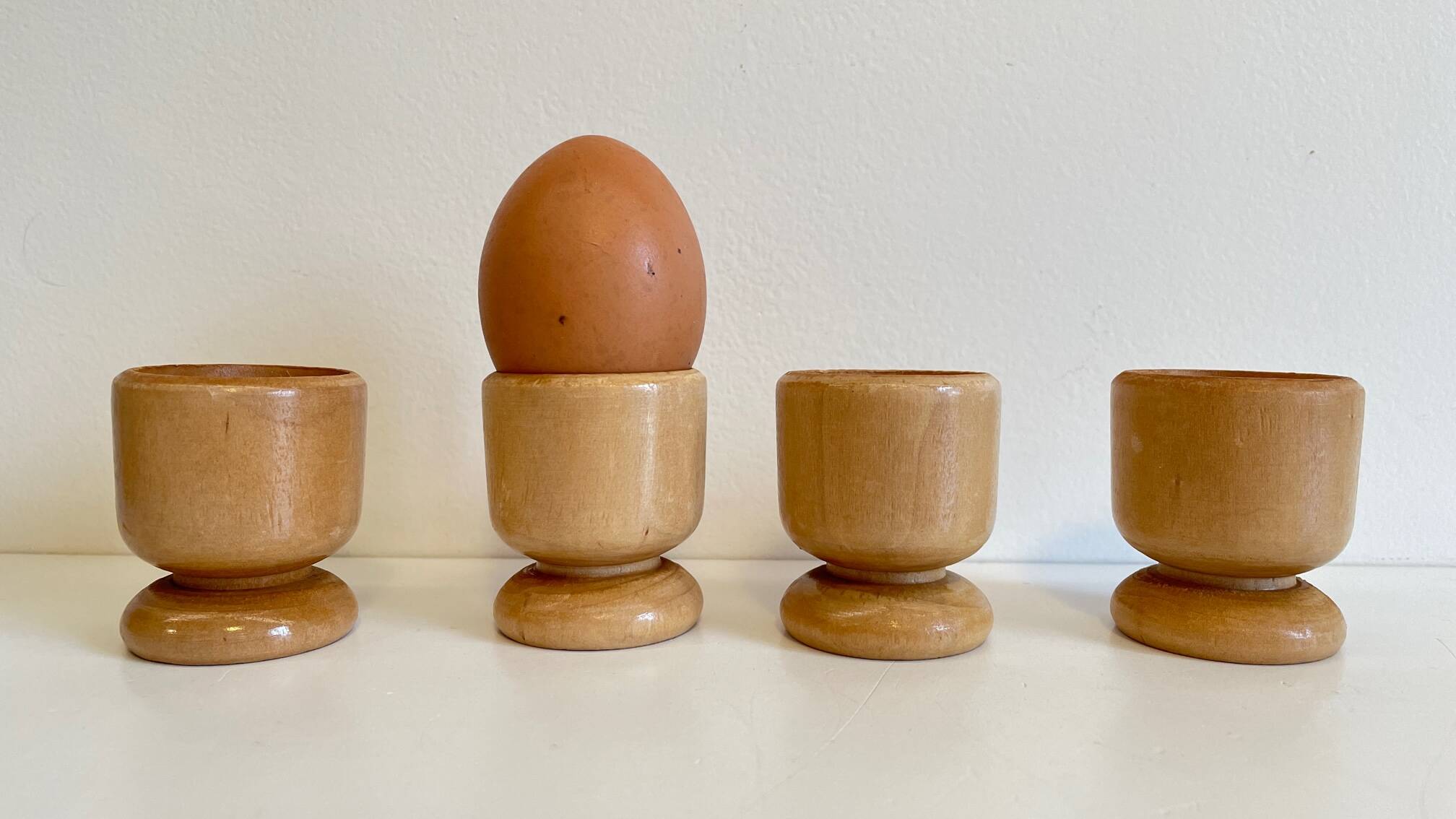 4 vintage turned wooden egg cups