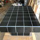 Black tiled coffee table and midnight blue grout