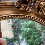 Bevelled oval mirror in vintage gilded wood 46x62cm