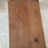 Church bench in fir tree with armrests
