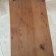 Church bench in fir tree with armrests