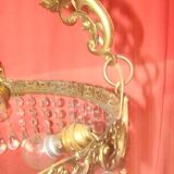 circular chandelier with a brass frame equipped with crystal drops