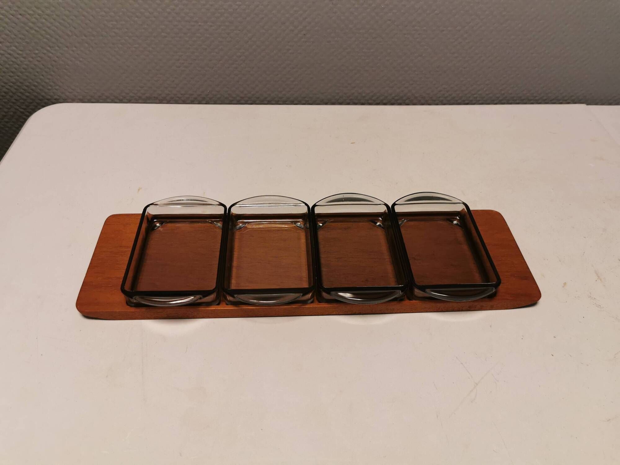 Teak Cabaret tray with four smoke coloured glass bowls, Danish and produced by Wiggers 1970s.