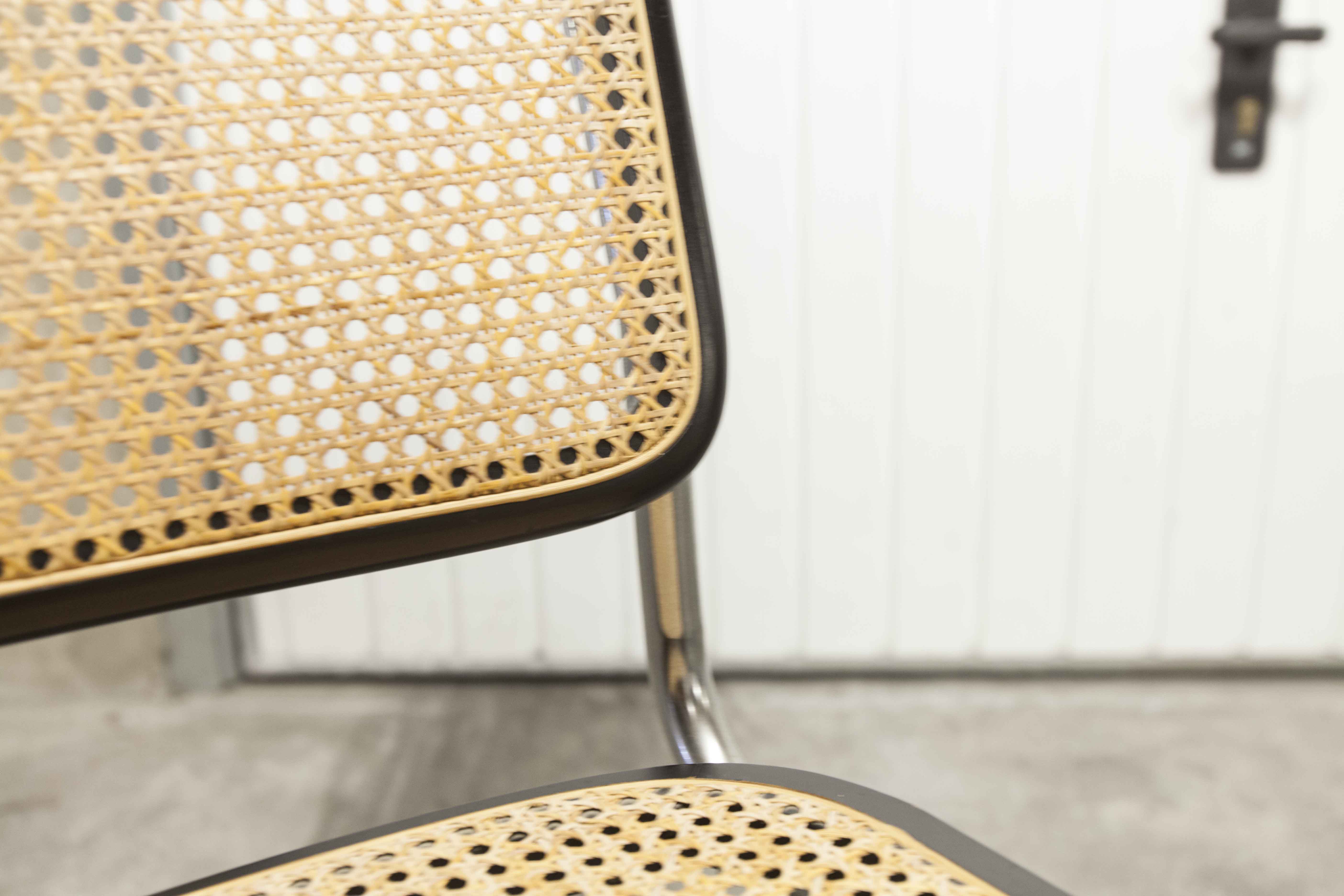 Pair of black Breuer b32 chairs and cannage