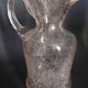 Small blown glass pitcher with bubbles from the 20th century.