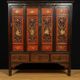 China 19th century: Red lacquer cabinet with gilding from the Qing Dynasty.
