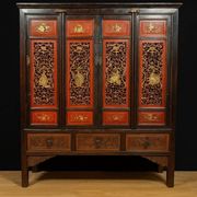 China 19th century: Red lacquer cabinet with gilding from the Qing Dynasty.