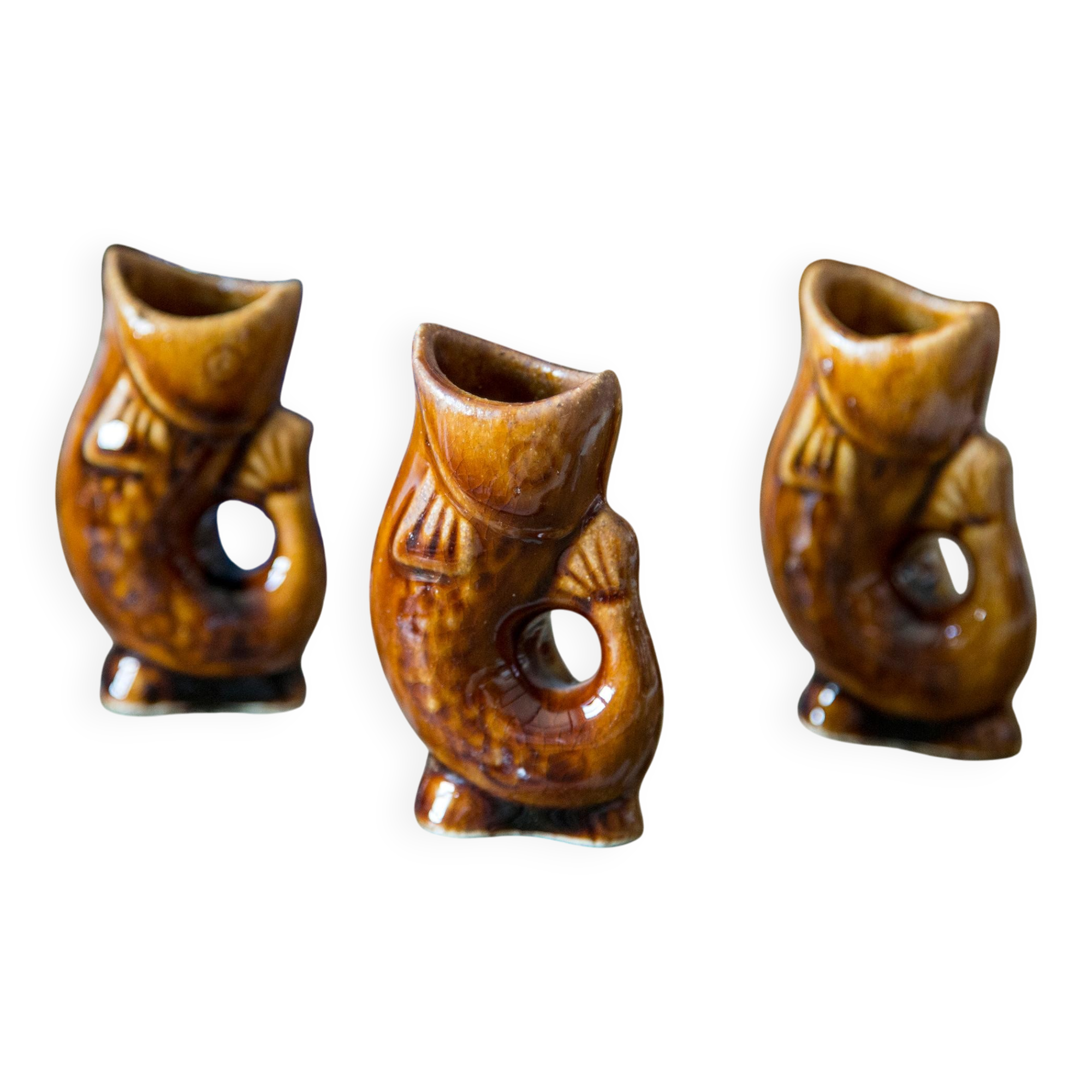 Set of three small brown glass fish, 20th century, Europe, 1960s