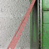 Industrial letter "t" in red metal