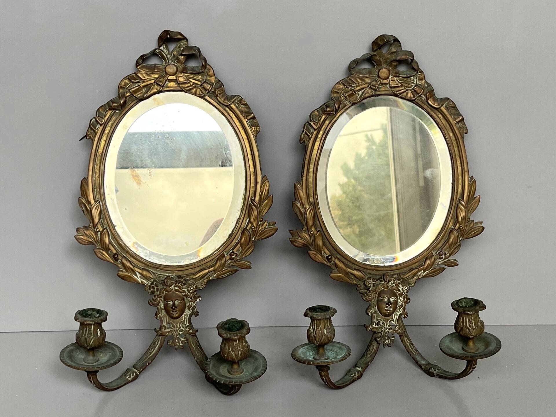 Pair of mirror sconces with bronze candlesticks from the 19th century.