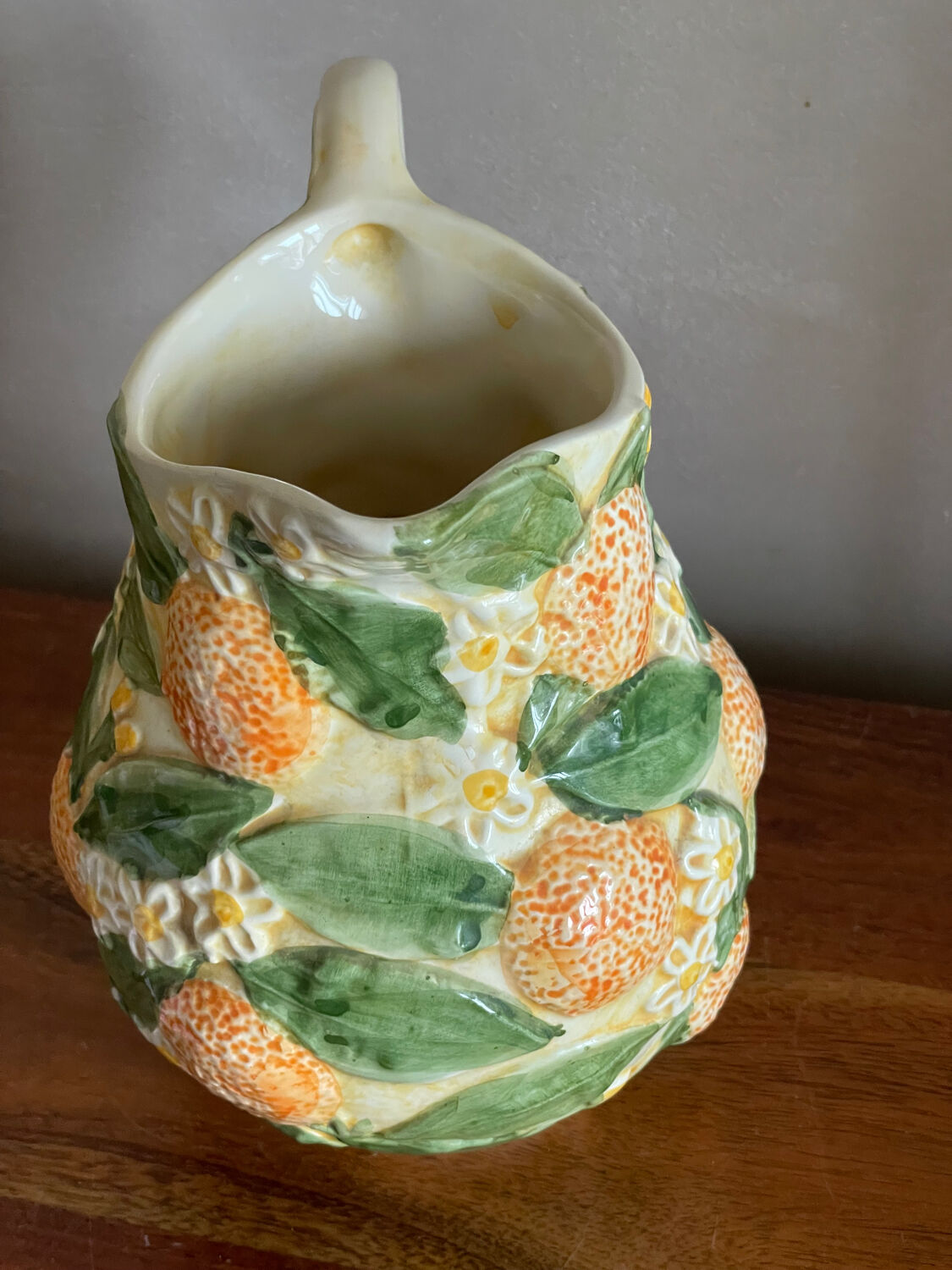 Orange slipware pitcher