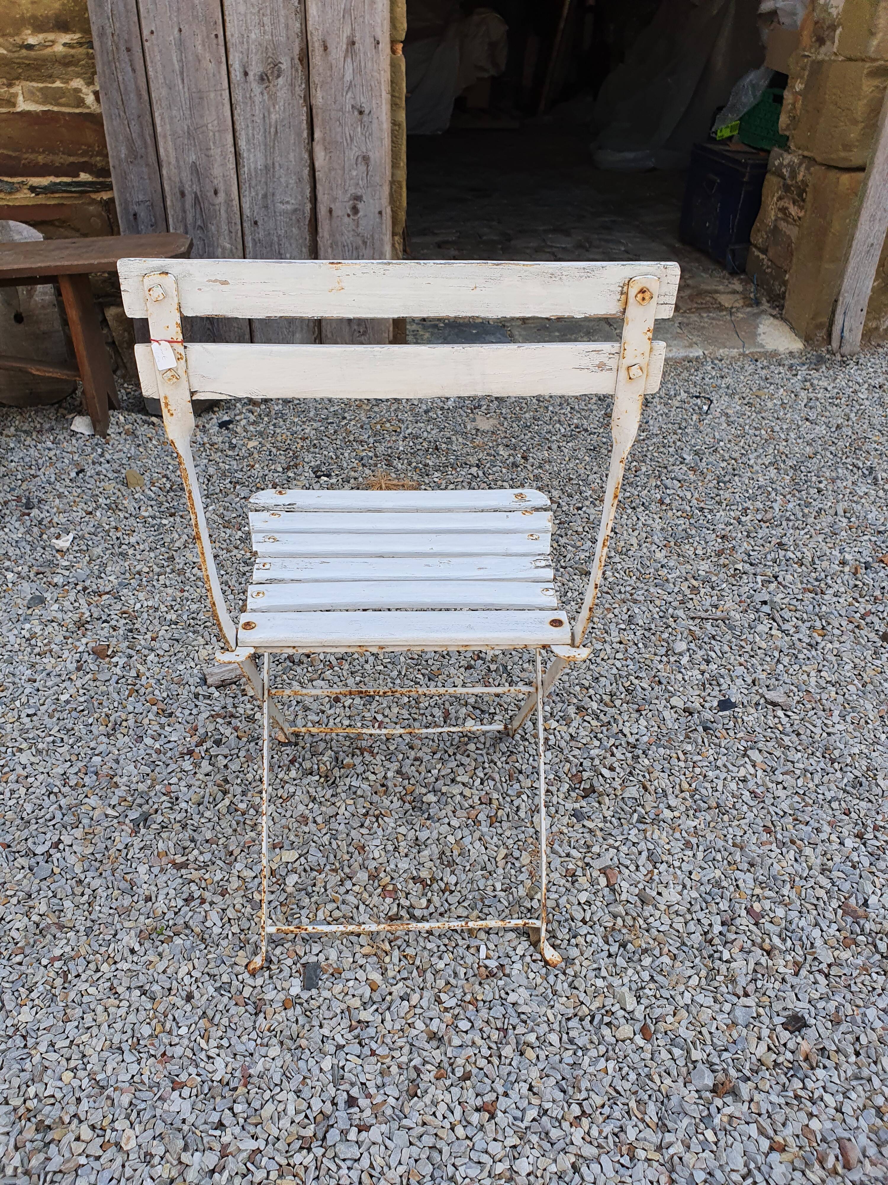 Wooden slatted garden chair with wooden slats and iron feet