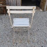 Wooden slatted garden chair with wooden slats and iron feet