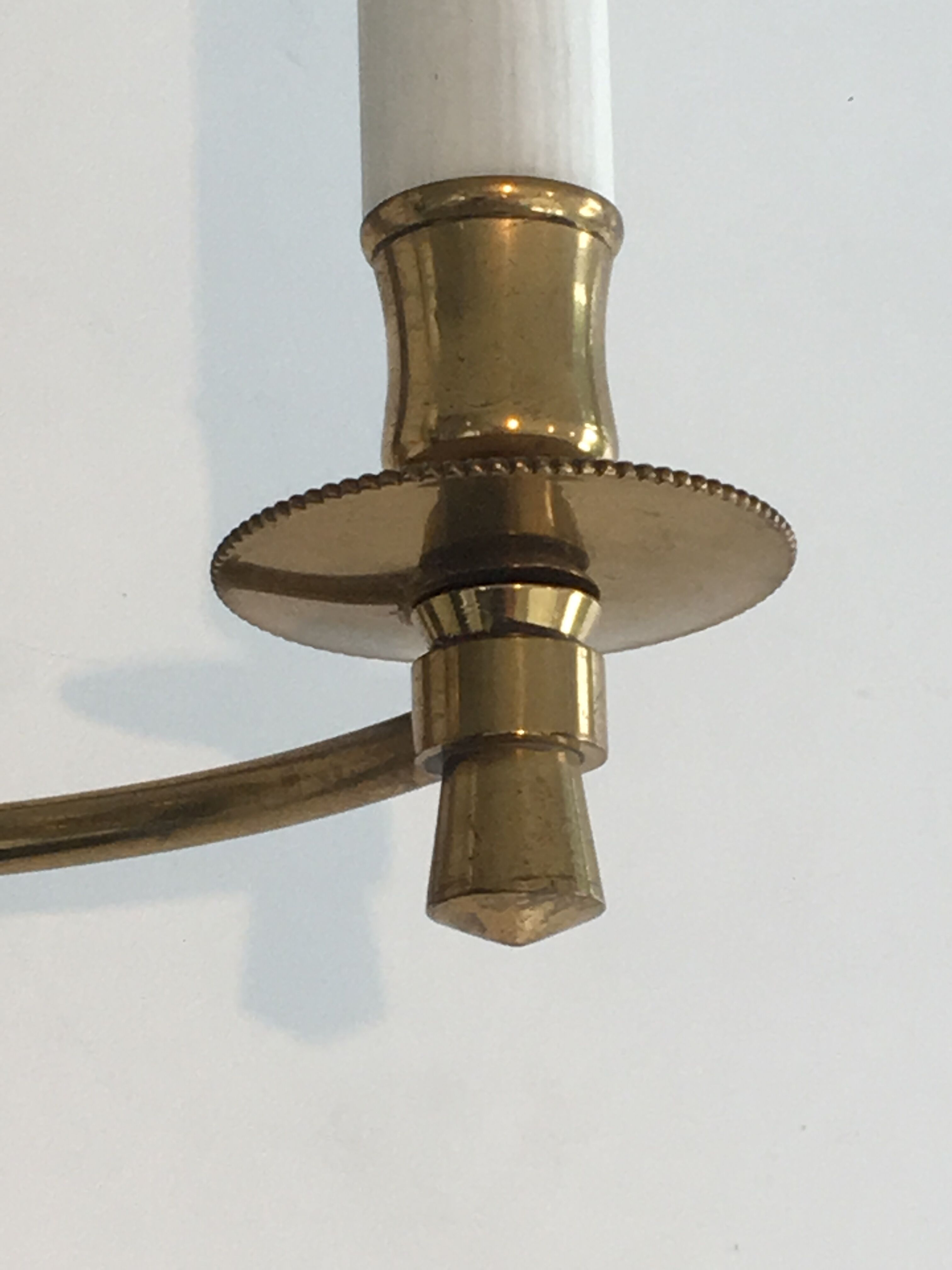 Pair of Black Lacquered Bronze Wall Lamps with Lions' Head Decorations. Around 1970