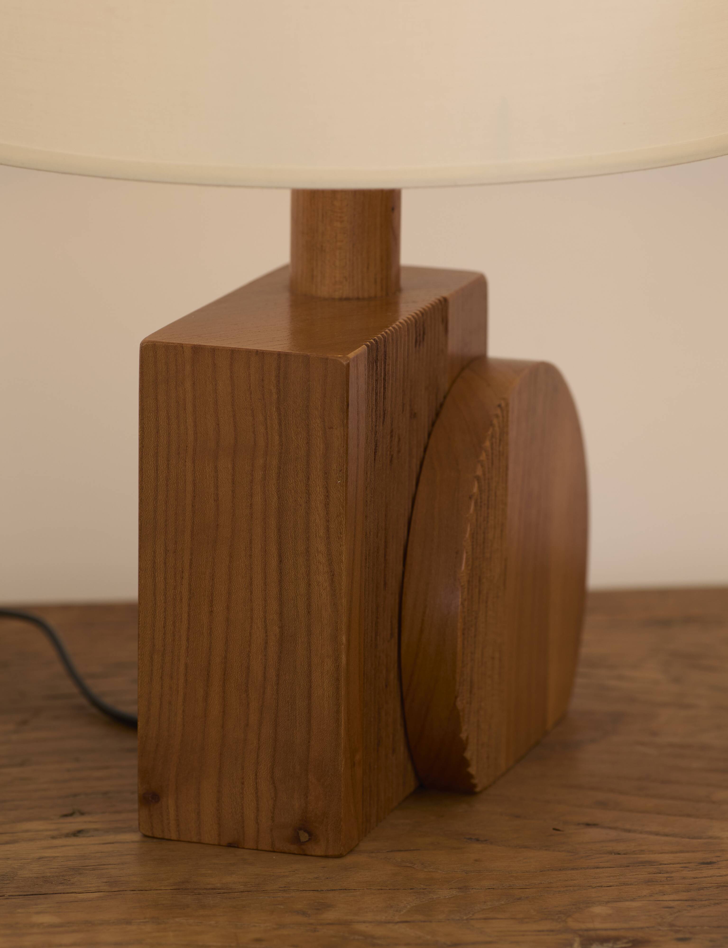Pair of geometric handcrafted lamps in solid oak circa 1970.