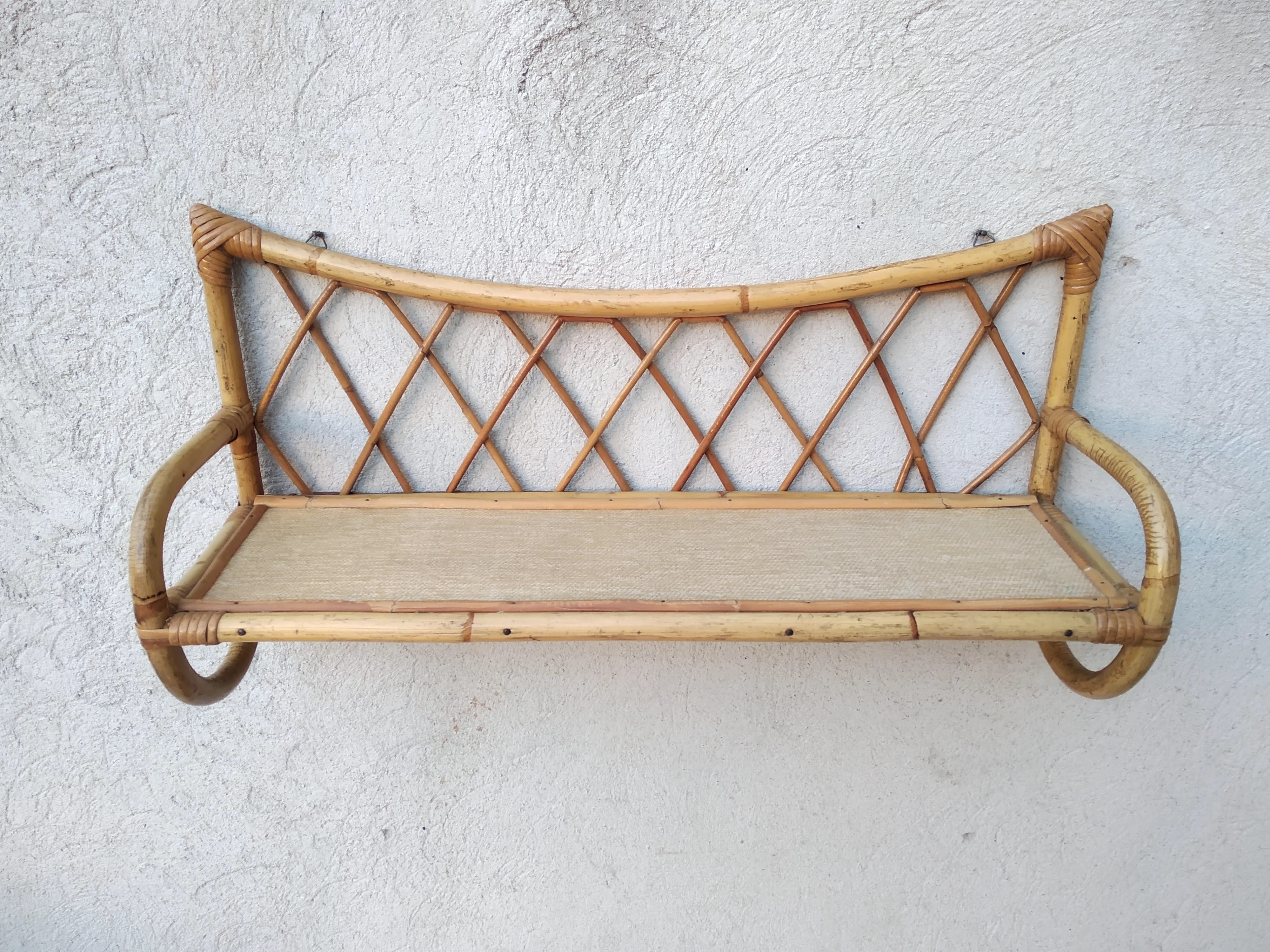 Rattan wall shelf from the 60s