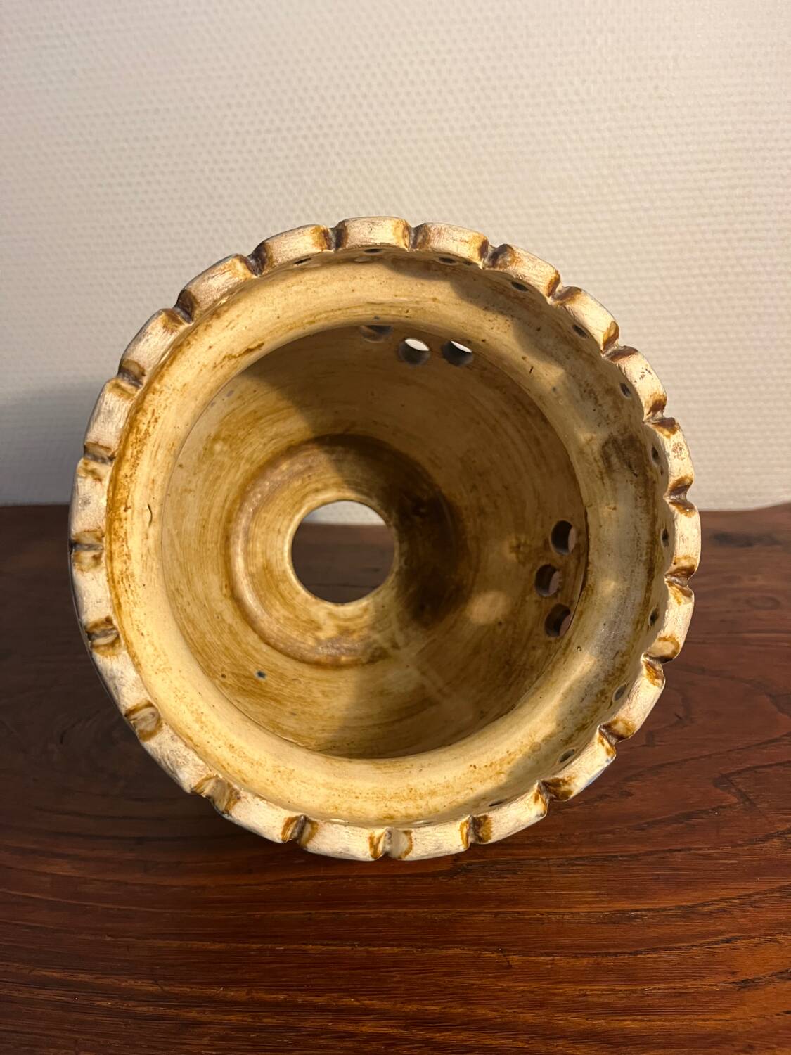 Ceramic suspension with openings