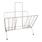 Vintage gold metal magazine rack in 50s Scandinavian style.