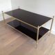 Neoclassical style coffee table in bronze and brass with double black lacquered glass tops from Maison Baguès