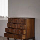 Antique baroque oak commode from the late 18th century with cabriole legs.