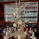 Large floral Art Nouveau chandelier in patinated bronze and metal.