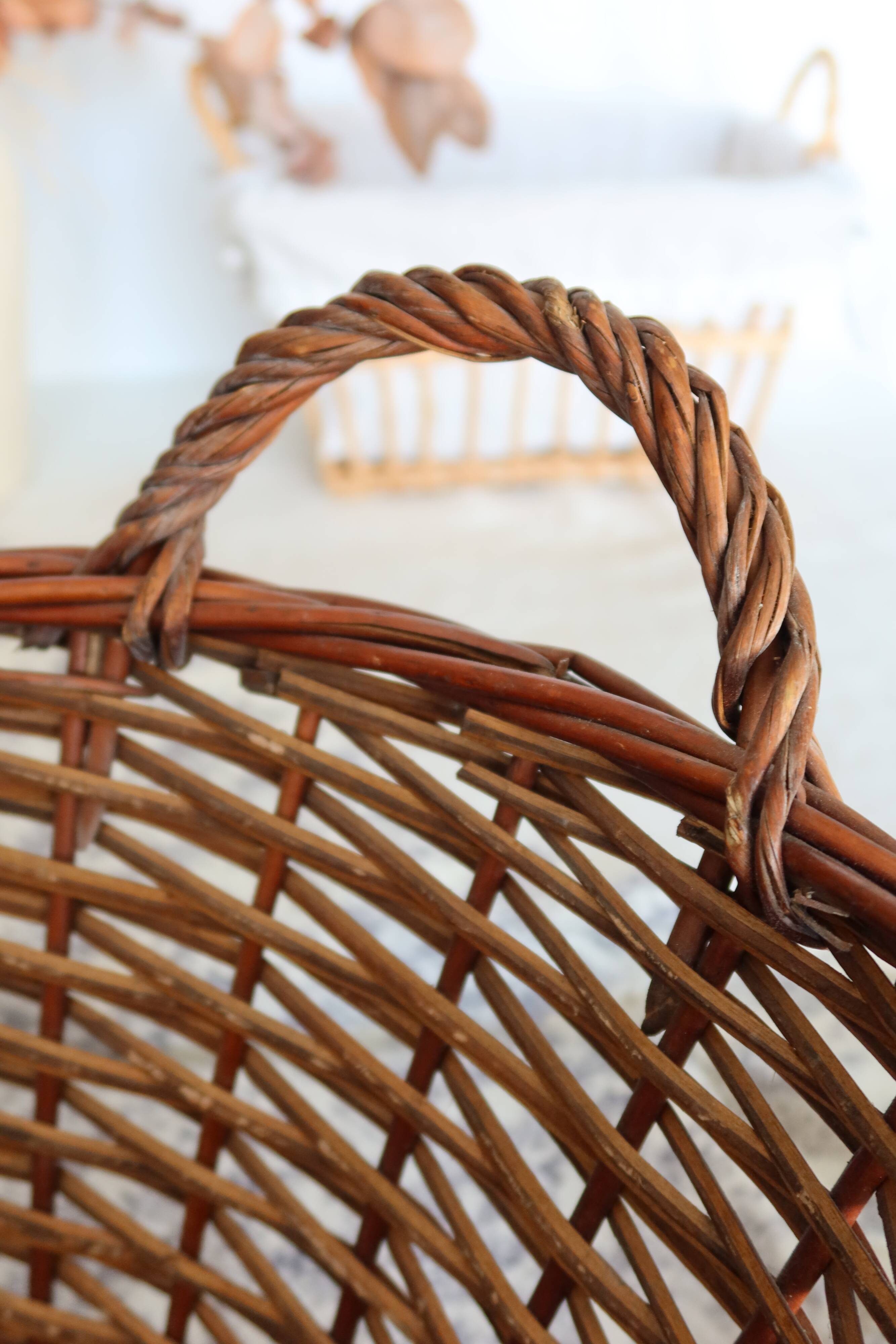 Large vintage dark wicker basket with handles