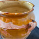 Old grease pot in glazed yellow terracotta, France nineteenth century