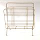 Gold metal magazine rack