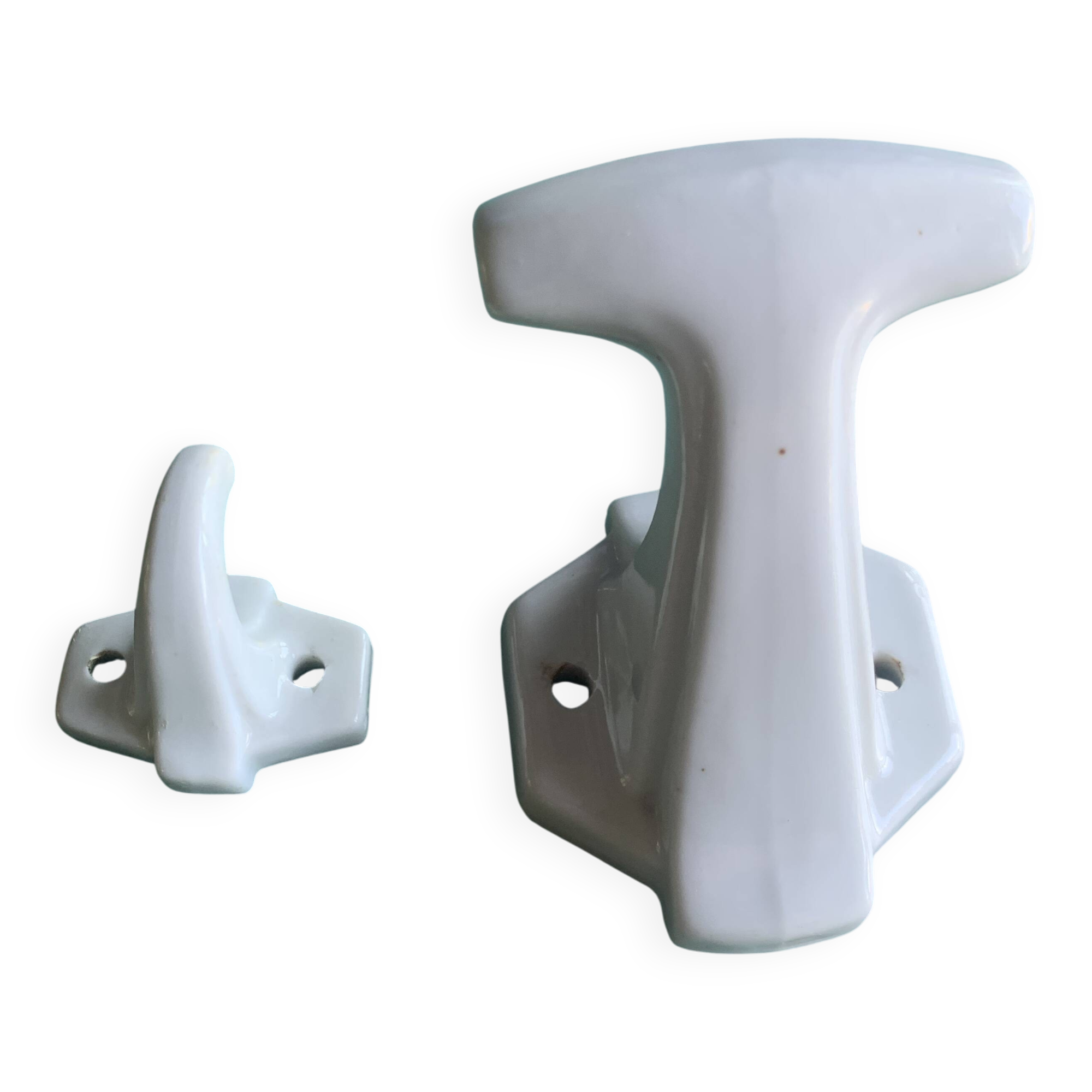 Two white porcelain coat hooks, one small and one larger, old