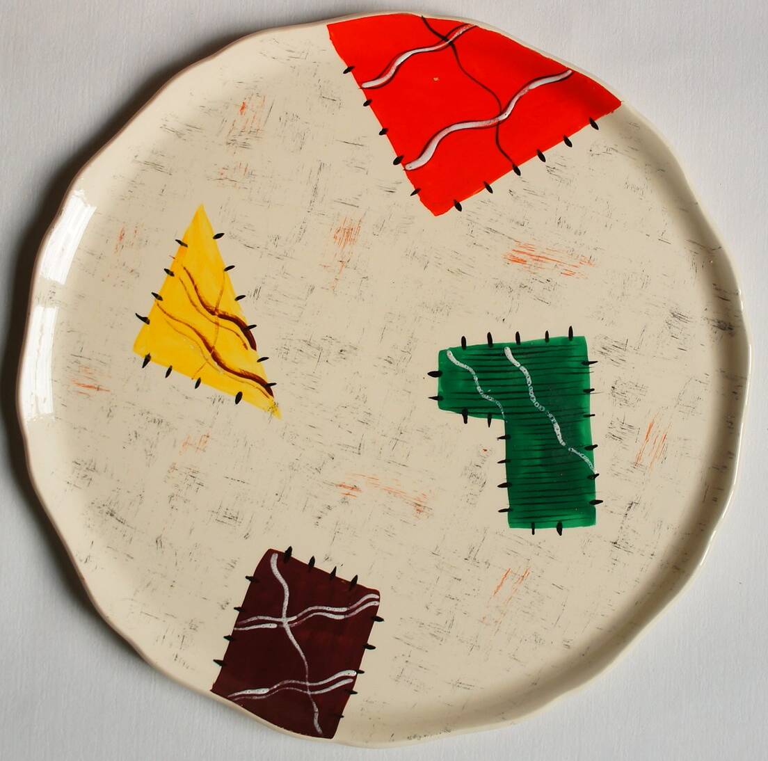 Large Longwy dish, hand-painted Harlequin model
