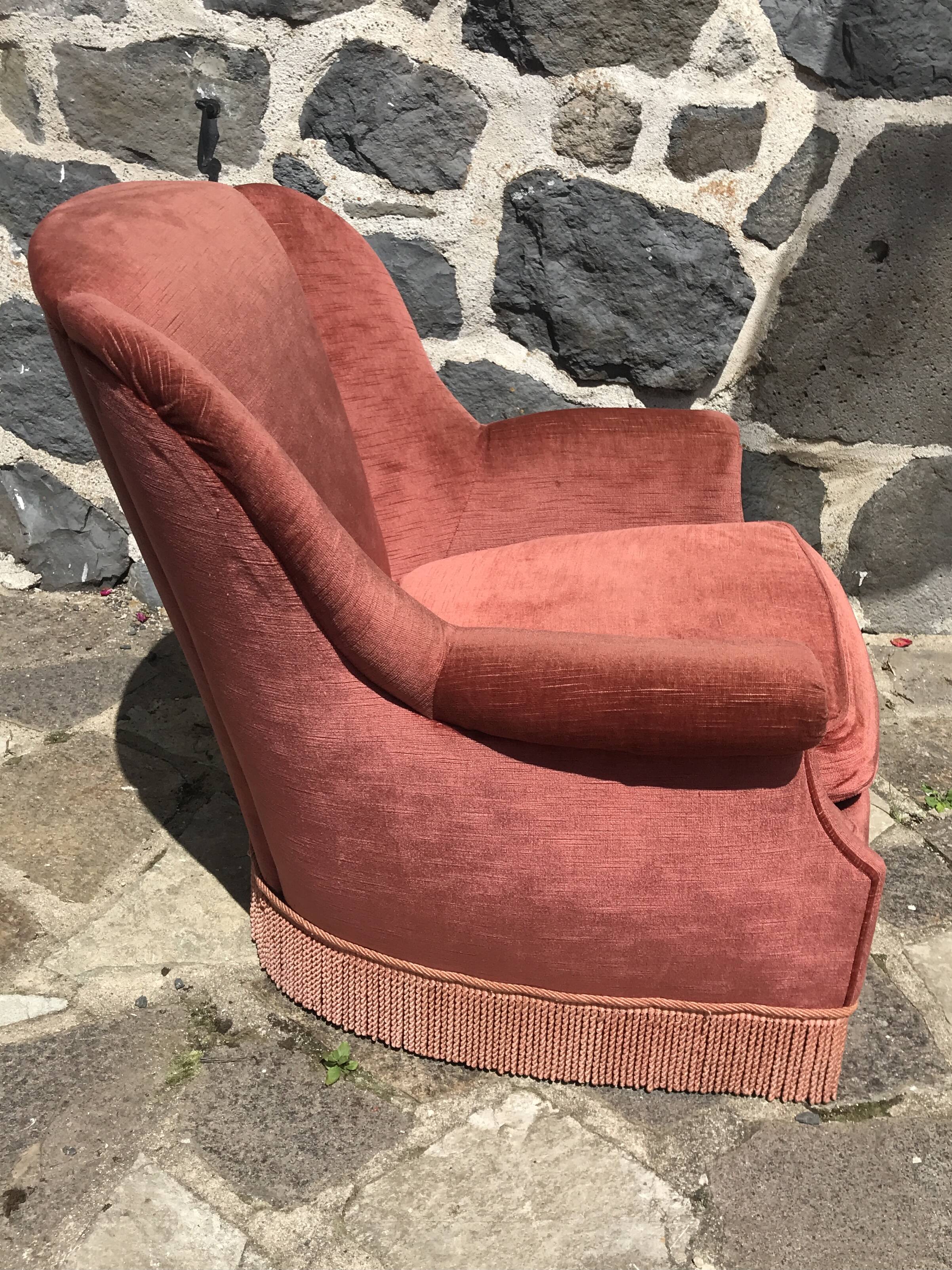 Vintage pink velvet armchair with fringes