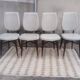 Set of 4 white and wooden Scandinavian chairs.