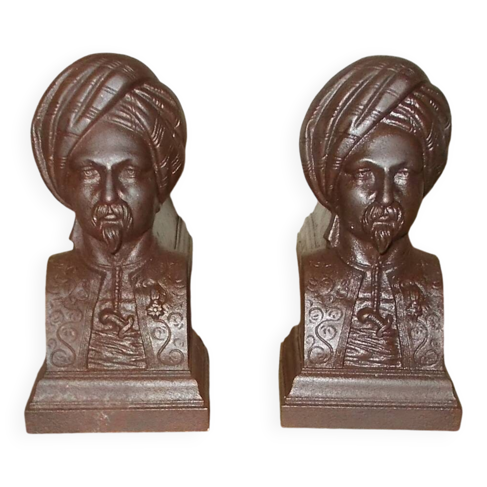 Old cast iron andirons with oriental decor