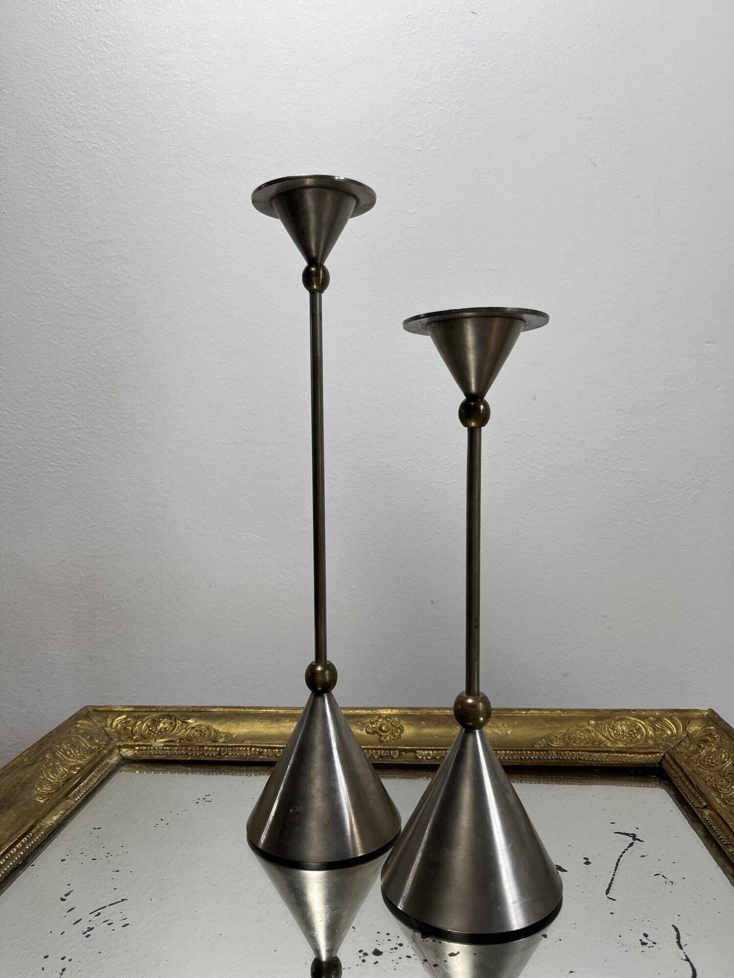 Pair of high vintage metal and brass candlesticks