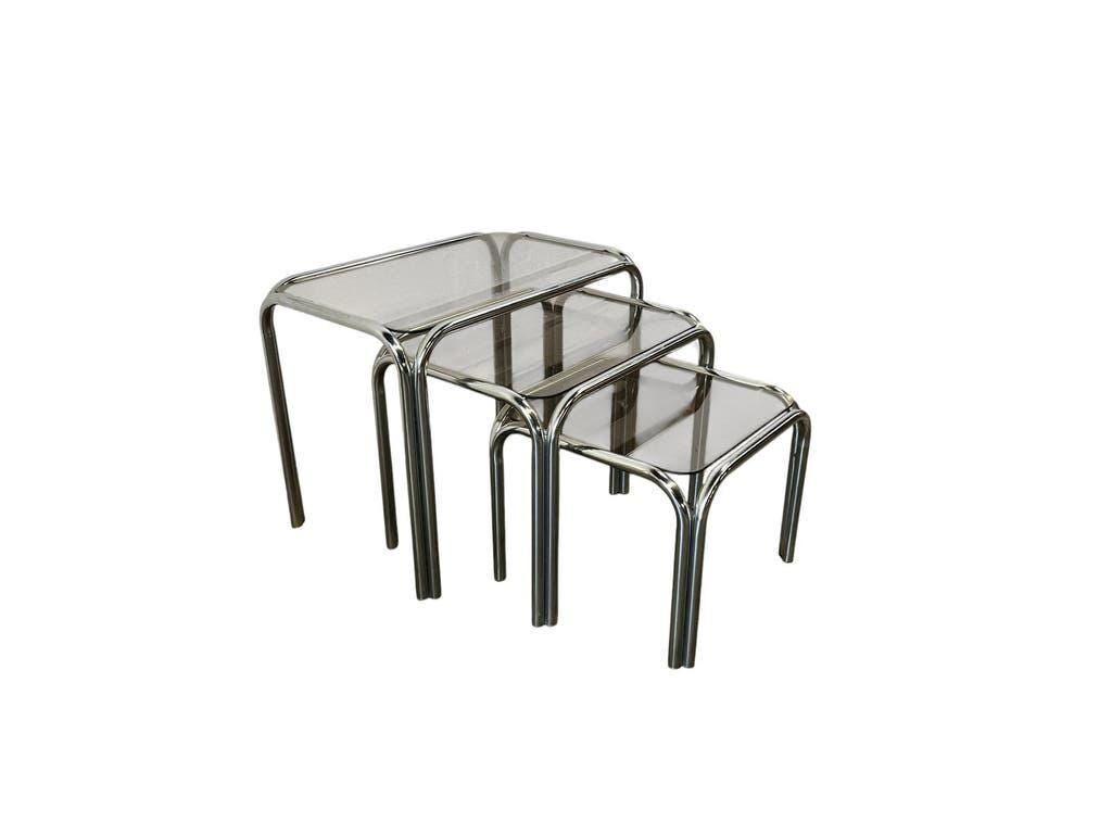 Set of 3 vintage chrome nesting tables with smoked glass.