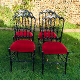4 black reception chairs with red seats