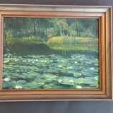 Original oil painting of a landscape with a pond and water lilies by Albert Morhain, 1930.